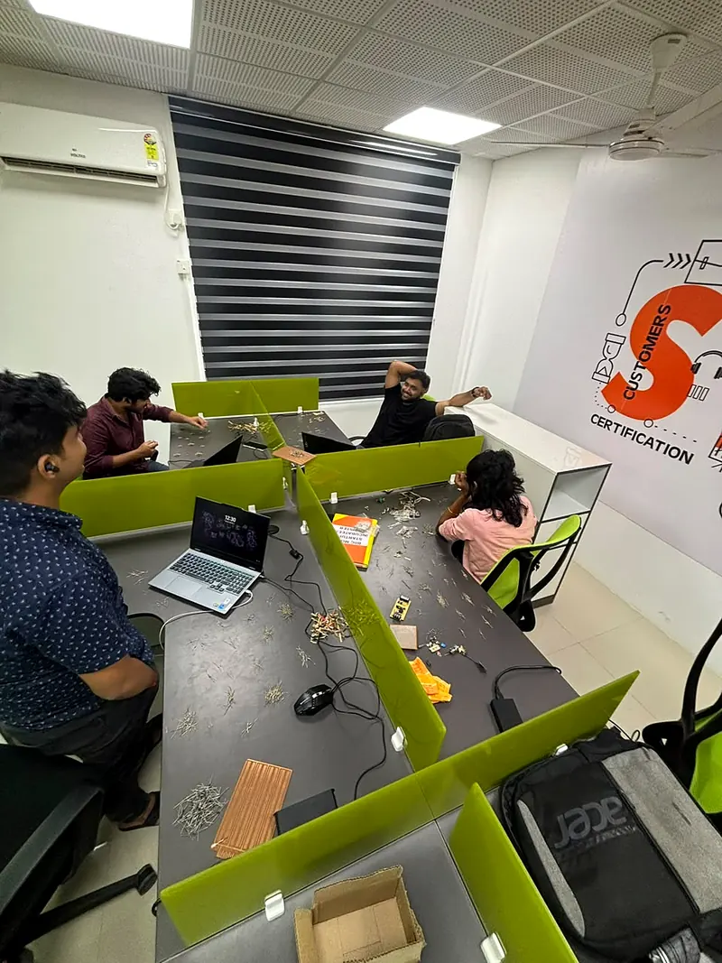 The team at work at the green desks