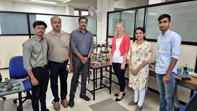 The Nexospark team with international visitors in the drone lab